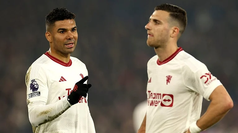 Manchester United's Casemiro, left, and Manchester United's Diogo Dalot react disappointed after the English Premier League soccer match between Crystal Palace and Manchester United. - AP