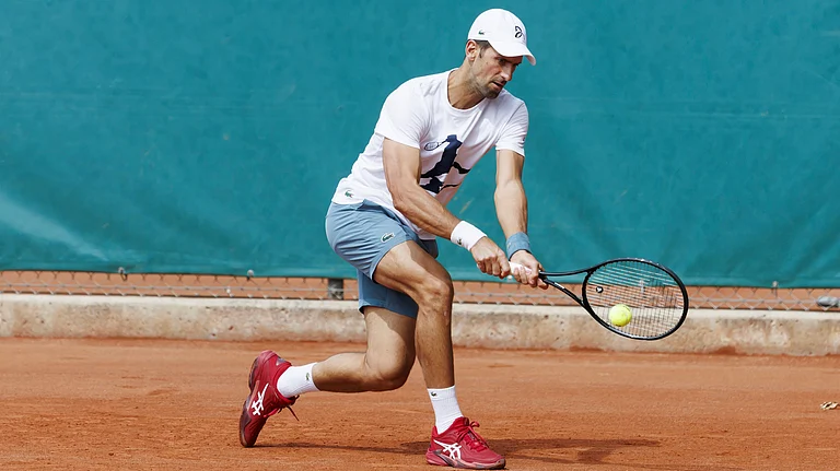 Novak Djokovic of Serbia returns a ball during a training session at the ATP 250 Geneva Open tournament in Geneva, Switzerland. - AP
