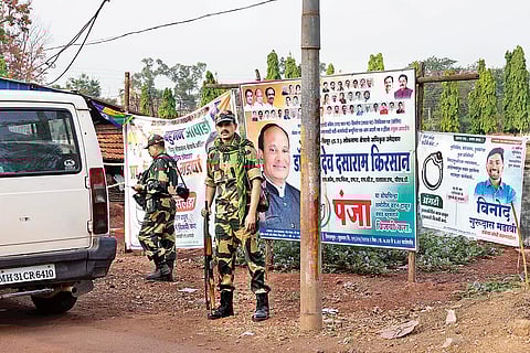 CRPF personnel guard a main road in Gadchiroli ahead of the first phase of voting
