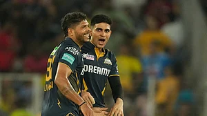 AP Photo/Ajit Solanki : Gujarat Titans' captain Shubman Gill and Umesh Yadav celebrate