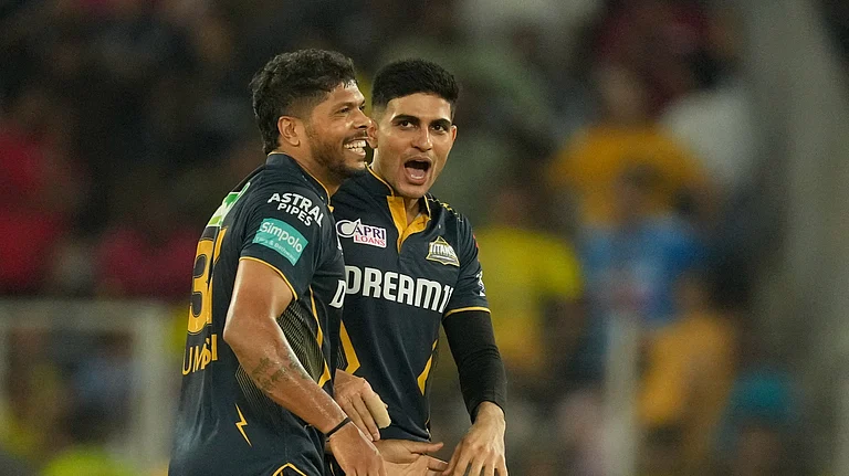 Gujarat Titans' captain Shubman Gill and Umesh Yadav celebrate - AP Photo/Ajit Solanki