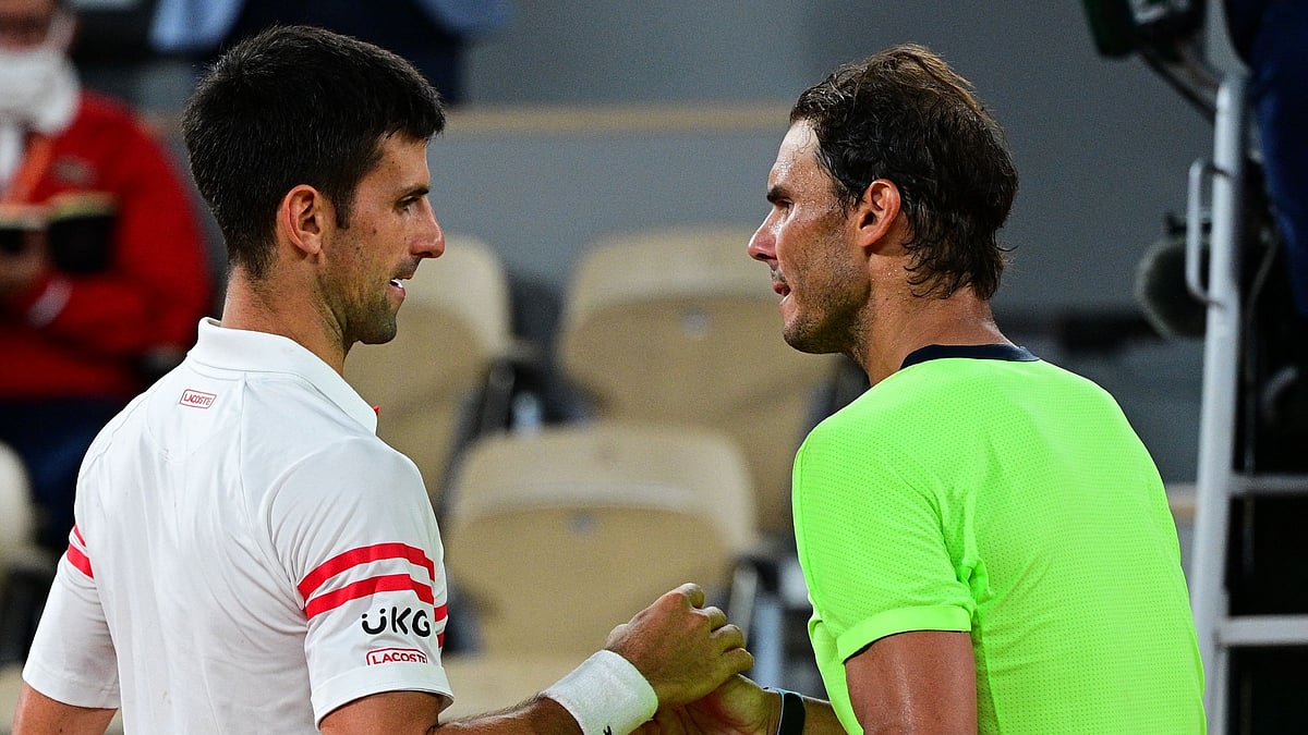 Novak Djokovic and Rafael Nadal meet at the net after their epic clash