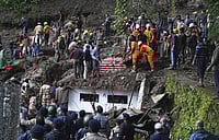 Associated Press : A landslide that struck near a temple on the outskirts of Shimla, Himachal Pradesh, on August 14, 2023.