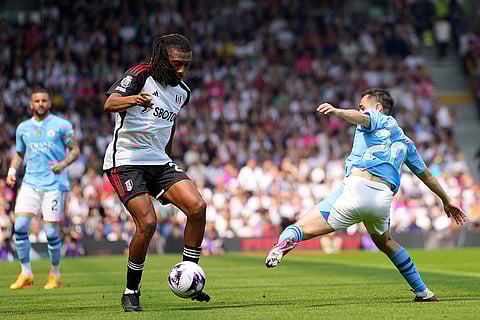 Bernardo Silva, right, challenges with Alex Iwobi