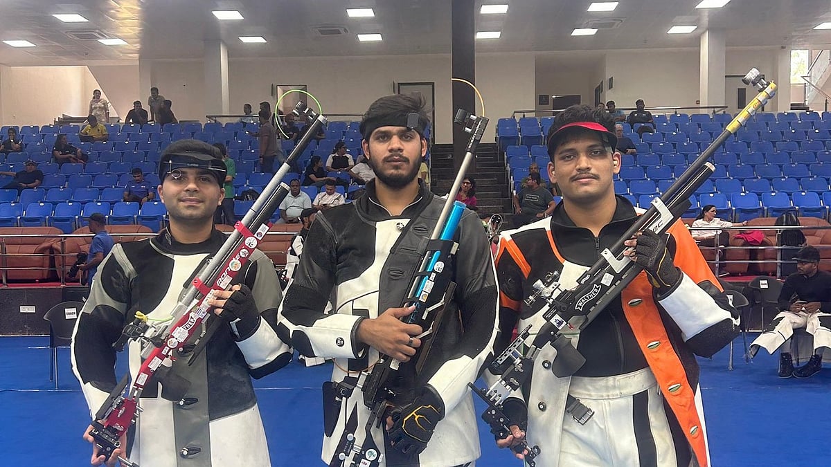 Photo: X/ @OfficialNRAI : Divyansh Singh Panwar (centre) shoots 253.3 in the final to win the men’s 10M Air Rifle OST T4. Arjun Babuta (left) was second and Rudrankksh Patil (right) was third.