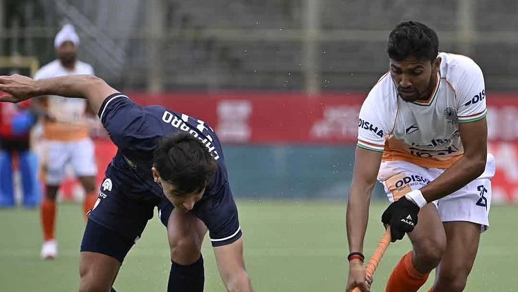 Photo: X/ @TheHockeyIndia : Indian player tackling Argentinian player in IND Vs ARG, FIH men's Pro League match on Wednesday.