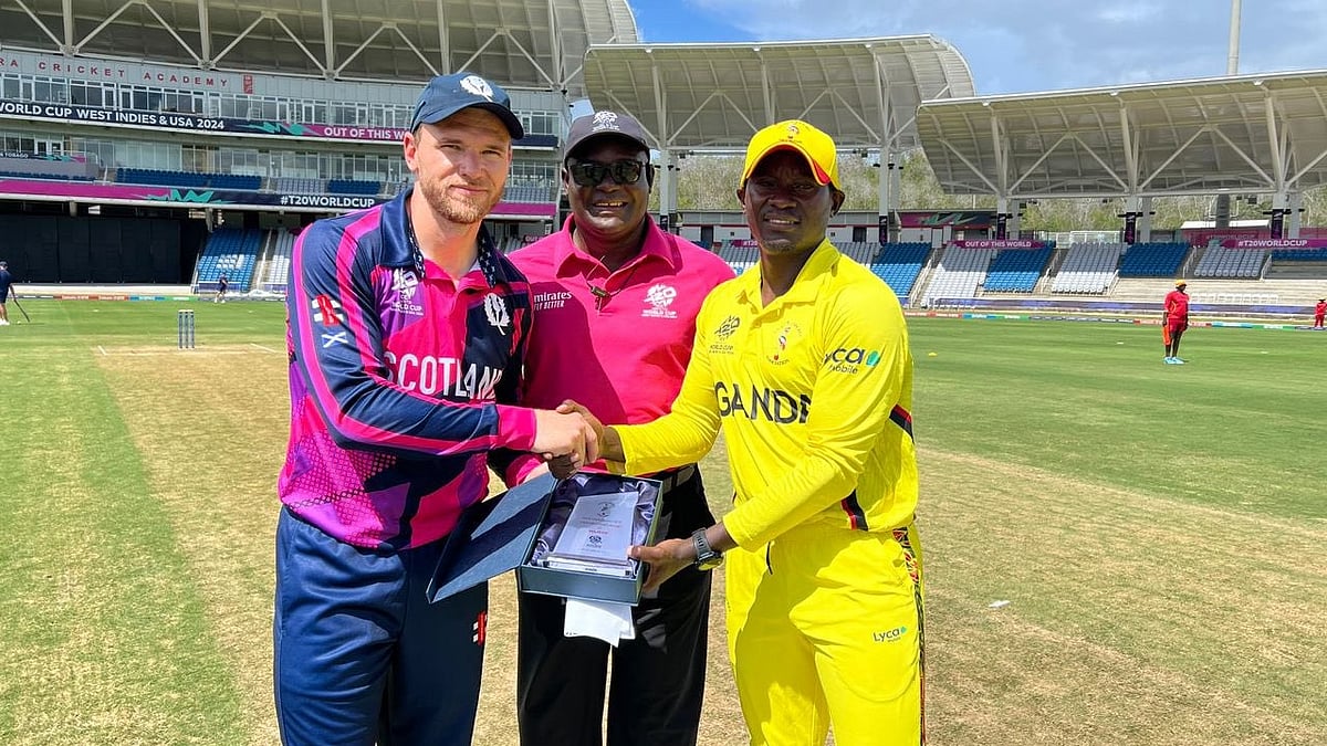 X/Uganda Cricket Association  : Captains Richie Berrington (left) and Brian Masaba at the toss for the Scotland vs Uganda, T20 World Cup 2024 warm-up match in Tarouba on Thursday (May 30). 