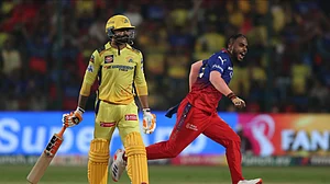 AP Photo/Kashif Masood : Royal Challengers Bengaluru's Yash Dayal, right, celebrates after winning the Indian Premier League cricket against Chennai Super Kings in Bengaluru.