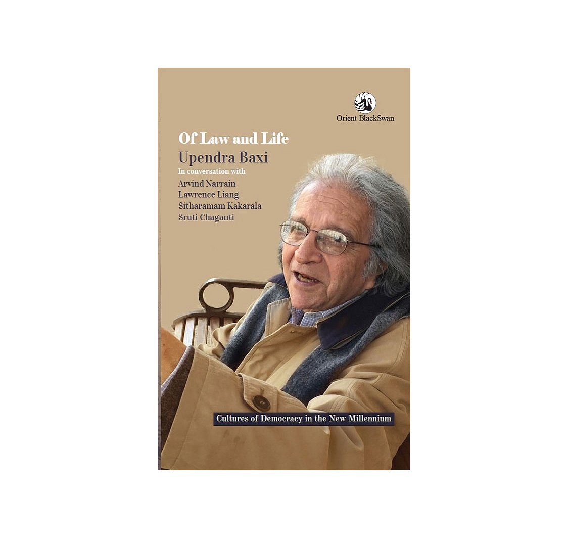 A customer carries take-out food from a McDonald's Corp. restaurant,