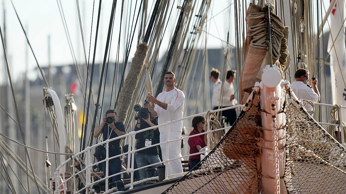  (AP Photo/Thibault Camus)


 : First torch carrier in France French Olympic swimmer Florent Manaudou holds the Olympic torch aboard The Belem, the three-masted sailing ship in the Old port of Marseille, southern France, Wednesday, May 8, 2024. After leaving Marseille, a vast relay route is undertaken before the torch odyssey ends on July 27 in Paris. The Paris 2024 Olympic Games will run from July 26 to Aug.11, 2024.
