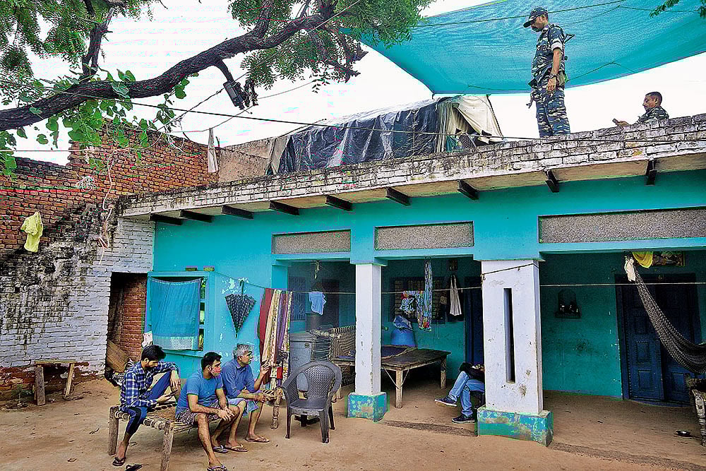 Photo: Suresh K. Pandey : CRPF jawans have been guarding the deceased girl's house since the incident. The family members say their presence has made them prisoners inside their own home 