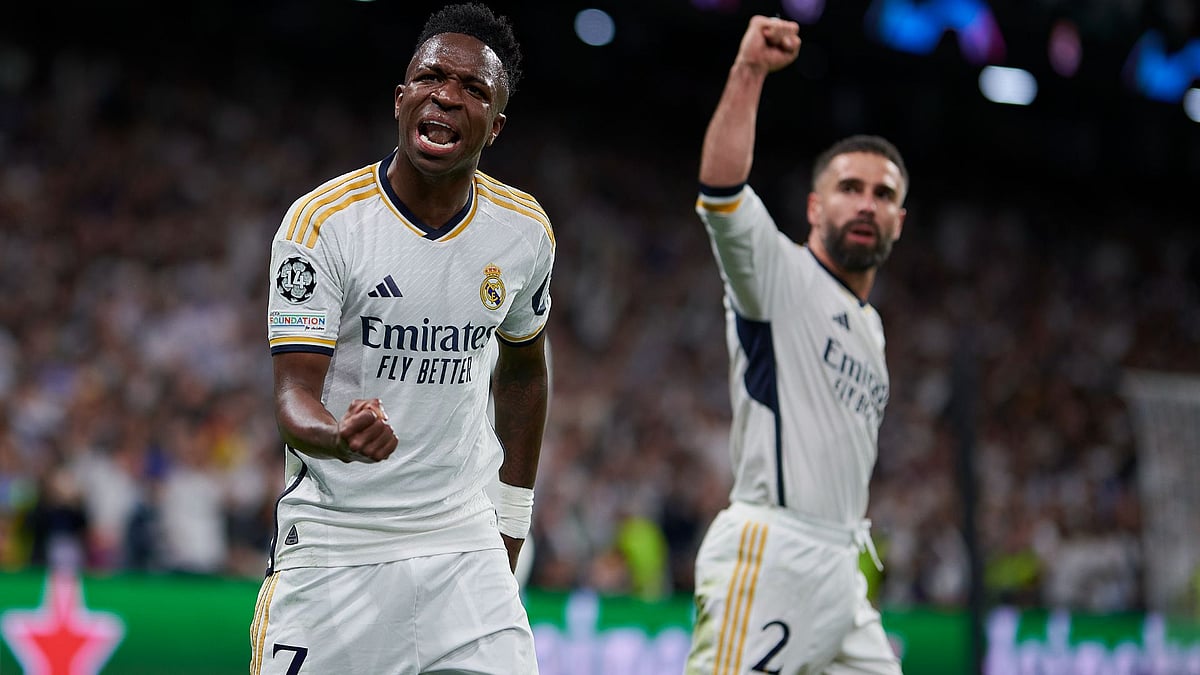 Real Madrid's Vinicius Junior and Dani Carvajal celebrate a goal against Manchester City.