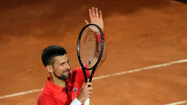 Serbia's Novak Djokovic celebrates after winning a match against France's Corentin Moutet at the Italian Open tennis tournament in Rome. - AP Photo/Alessandra Tarantino