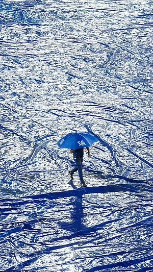 AP Photo : A ground staff walks with an umbrella during rain before the start of the Indian Premier League cricket match between Gujrat Titans and Sunrisers Hyderabad in Hyderabad.