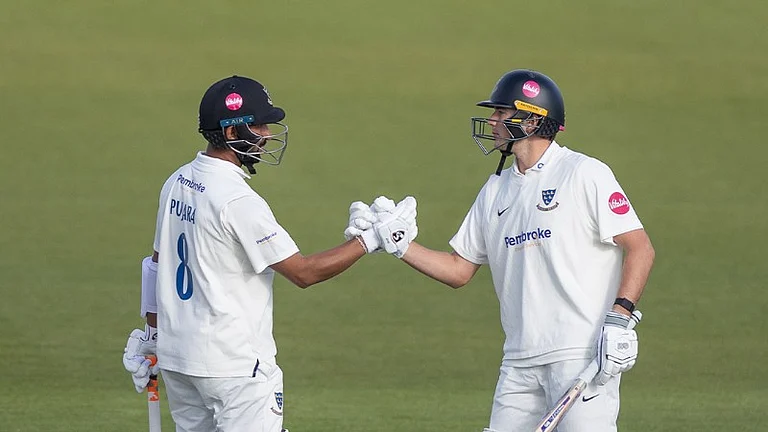 Cheteshwar Puajara (first from left) with James Coles in action during the Sussex vs Derbyshire County Championship 2024 match on May 4, Saturday.  - X | Sussex Cricket