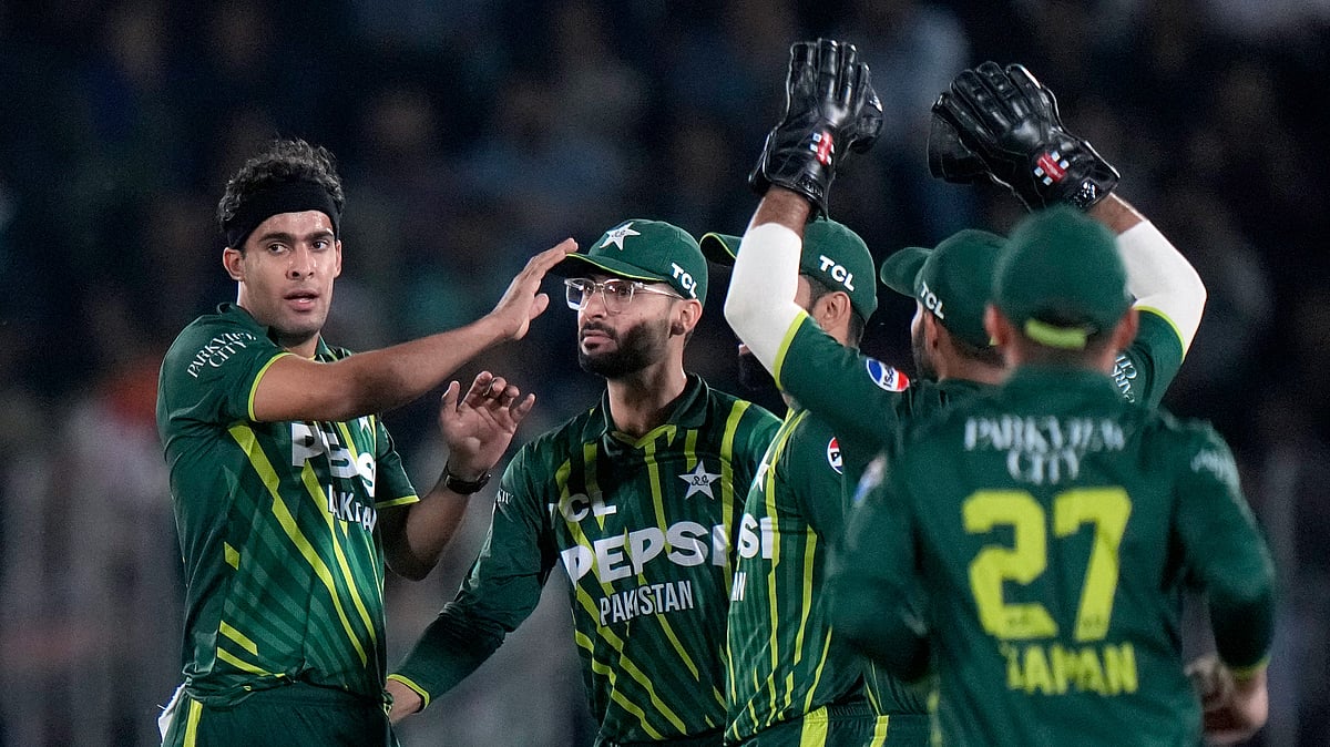 Anjum Naveed/AP : Pakistan's Abbas Afridi, left, celebrates with teammates after taking the wicket of New Zealand's Tim Seifert during their third T20 international cricket match in Rawalpindi on April 21, 2024.