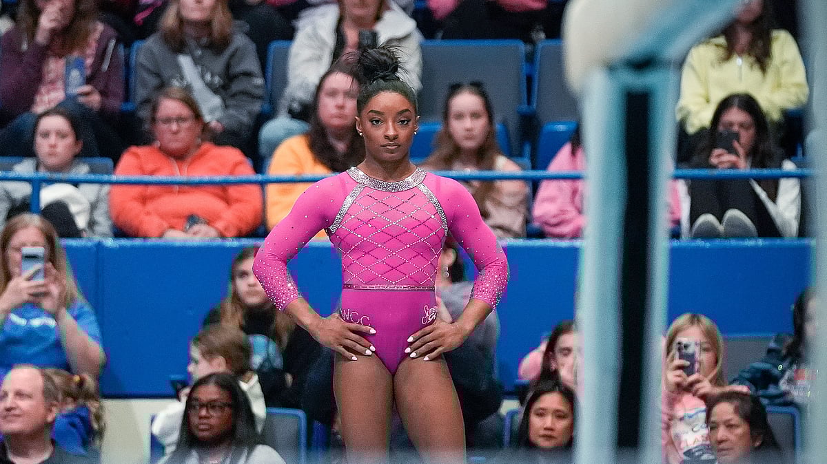 AP : Simone Biles prepares to compete on the balance beam during the U.S. Classic gymnastics event.