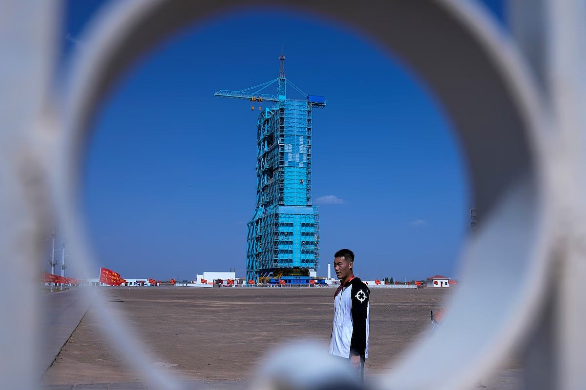 AP : Shenzhou-18 spacecraft, seen covered at the Jiuquan Satellite Launch Center during flight preparations | 