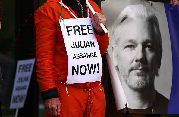 A Julian Assange supporter protests in front of Westminster Magistrates Court, in April, 2024. - Peter Nicholls/Getty Images