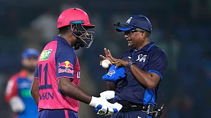 (AP Photo/Manish Swarup) : Rajasthan Royals' captain Sanju Samson talks to umpire after getting out during the Indian Premier League cricket match between Delhi Capitals and Rajasthan Royals in New Delhi, India, Tuesday, May 7, 2024.