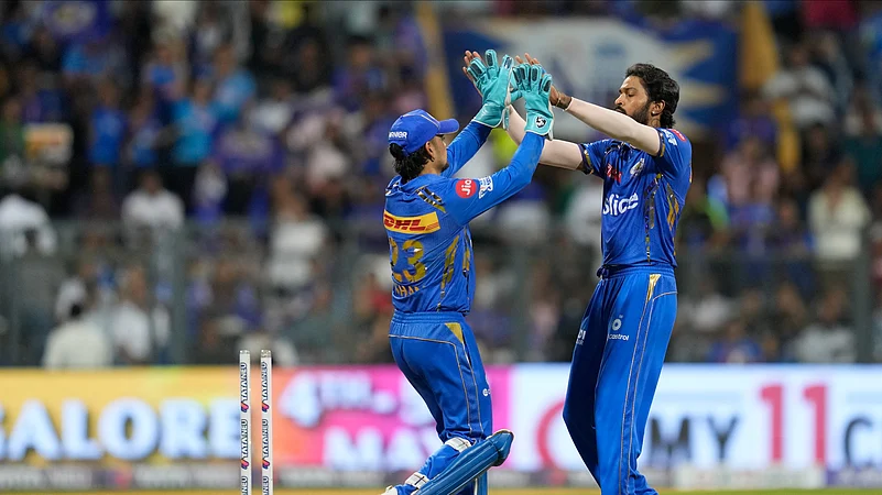 Hardik Pandya celebrating with Ishan Kishan in IPL 2024. AP Photo