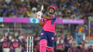 AP Photo/Ajit Solanki : Rajasthan Royals' Shimron Hetmyer watches the ball after playing a shot during the Indian Premier League eliminator cricket match between Royal Challengers Bengaluru and Rajasthan Royals in Ahmedabad.