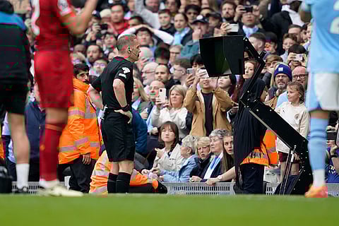 Referee checks VAR for penalty