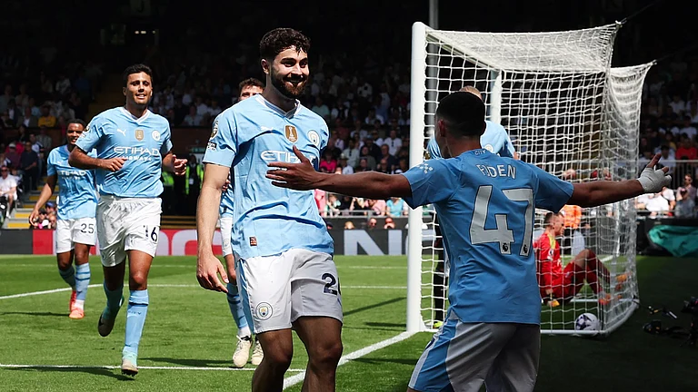 Josko Gvardiol celebrates with Phil Foden after scoring his second goal at Craven Cottage. - null