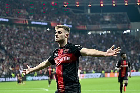 Josip Stanisic celebrates scoring a goal