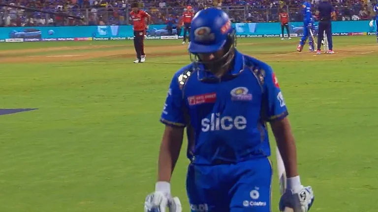MI batter Rohit Sharma walks back dejected to the dressing room. - X/SohelVkf