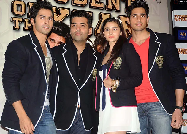 Karan Johar with Varun, Alia and Sidharth in 2012