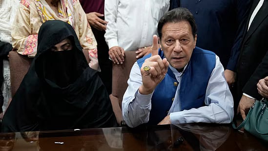 AP : Former Pakistan PM Imran Khan with his wife  Bushra Bibi |