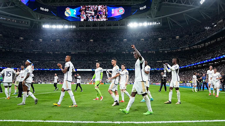 Real Madrid players celebrate at the end of the Champions League semifinal second leg soccer match between Real Madrid and Bayern Munich. - AP