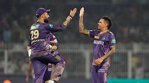 AP Photo/Bikas Das : Kolkata Knight Riders' Sunil Narine celebrates the wicket of Delhi Capitals' Axar Patel with teammates during the Indian Premier League cricket match between Delhi Capitals and Kolkata Knight Riders in Kolkata.