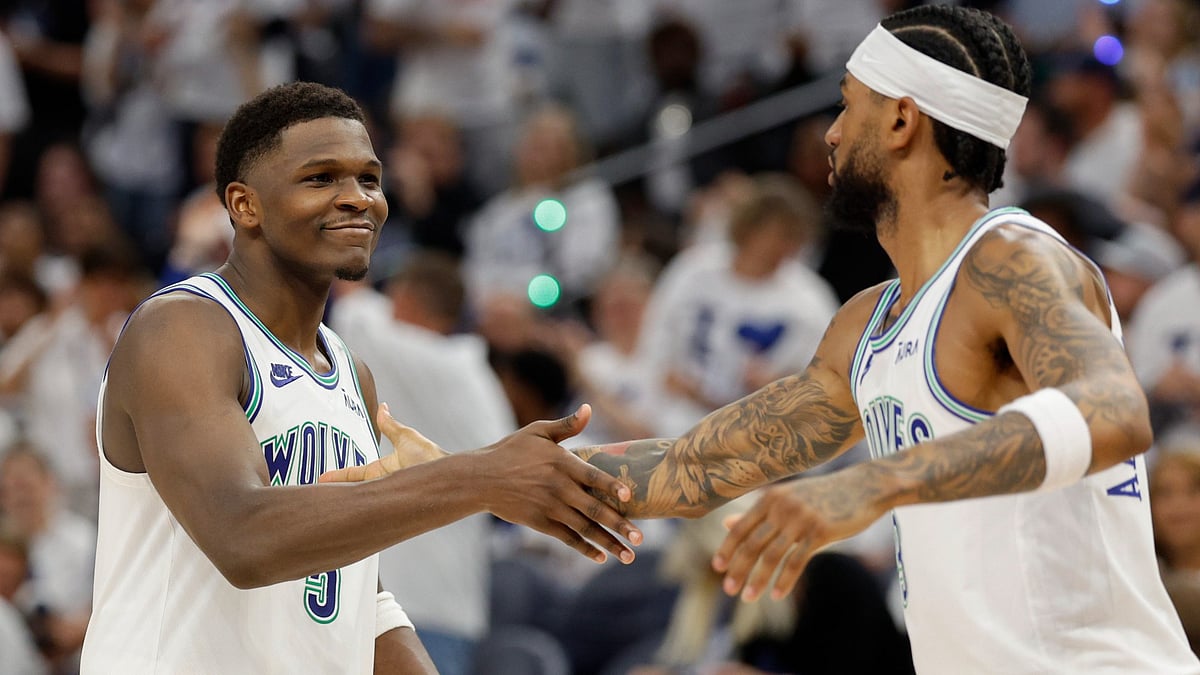 Anthony Edwards and Nickeil Alexander-Walker celebrate as the Minnesota Timberwolves routed the Denver Nuggets in Game 6.