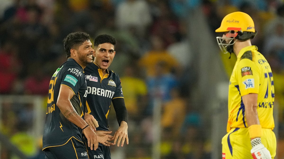 Gujarat Titans' captain Shubman Gill and Umesh Yadav celebrate the wicket of Chennai Super Kings' Captain Ruturaj Gaikwad during the Indian Premier League cricket match between Gujarat Titans and Chennai Super Kings in Ahmedabad. - AP Photo/Ajit Solanki