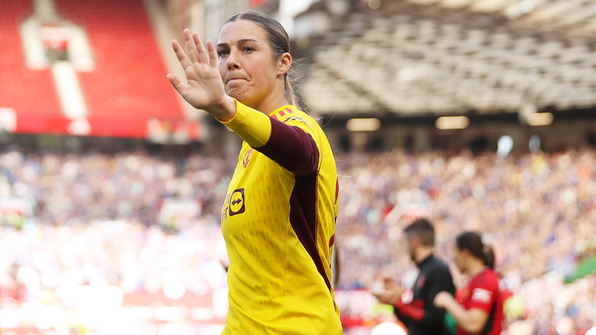 Mary Earps acknowledges Manchester United's fans after Sunday's 6-0 Women's Super League loss to Chelsea. - null