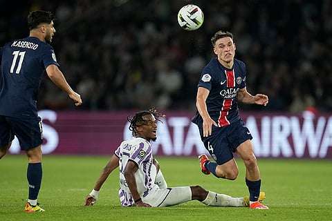 Manuel Ugarte and Toulouse's Yann Gboho fights for the ball
