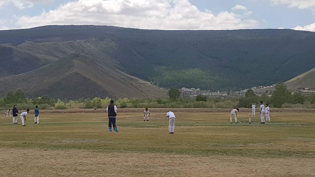 Young Mongolian kids play a cricket match. Cricket Mongolia Photo