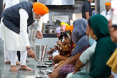 Prime Minister Narendra Modi serves 'langar'