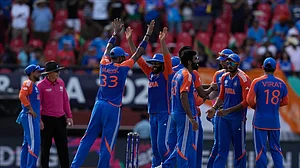 AP Photo/Ramon Espinosa : Indian players celebrate a dismissal during the ICC Men's T20 World Cup second semifinal cricket match between England and India at the Guyana National Stadium in Providence, Guyana.