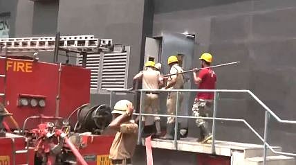 X/ Screengrab from video shared by ANI : Firefighters at Kolkata's Acropolis Mall |