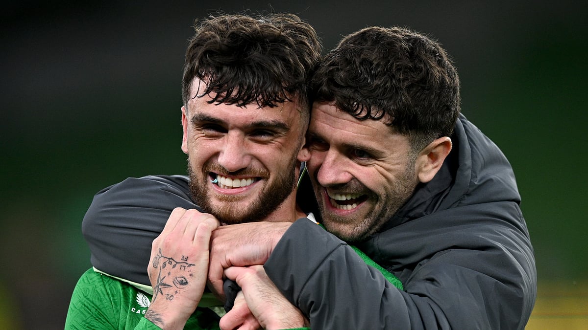 Troy Parrott celebrates his late winner for Ireland alongside Robbie Brady in Dublin - null