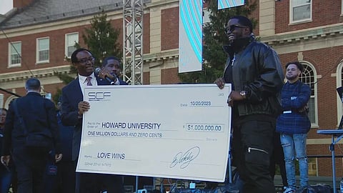 Sean Combs pledging one million dollar check for his scholarship program.