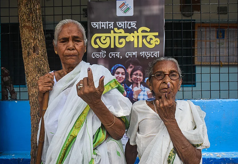 Old women are showing their voting mark after casting their vote at a Model Pink booth during the seventh and last phase of India's general election in Kolkata, India, on June 1, 2024. - (Photo by Sudipta Das via Getty Images)
