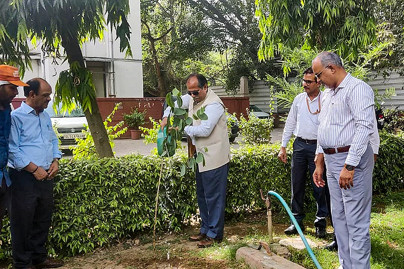 Justice Arun Kumar Tyagi plants a Tree sapling
