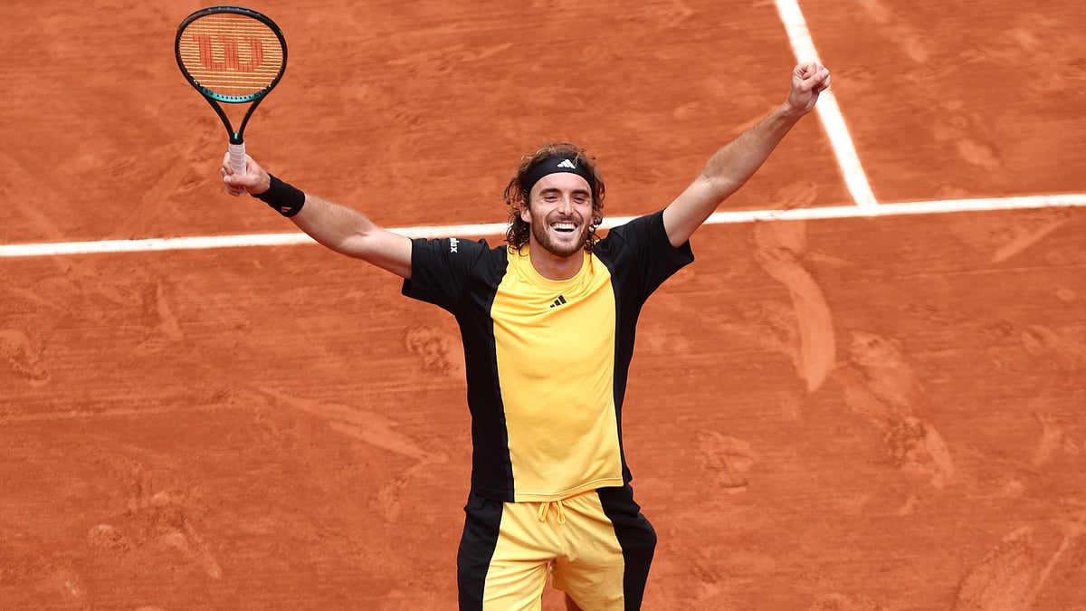 Stefanos Tsitsipas celebrates after converting match point