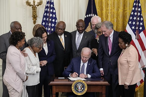 U.S. President Joe Biden signs the Juneteenth National Independence Day Act into law in the East Room of the White House on June 17, 2021 in Washington, DC.