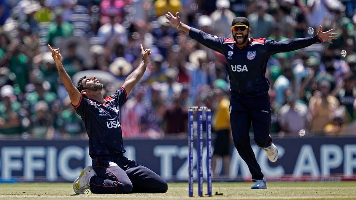 Photo: AP/PTI : United States' Saurabh Netravalkar, left, celebrates after their win in the ICC Men's T20 World Cup cricket match against Pakistan at the Grand Prairie Stadium in Texas.
