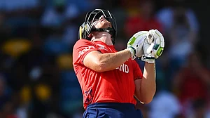 Jos Buttler reacts after he is dismissed.